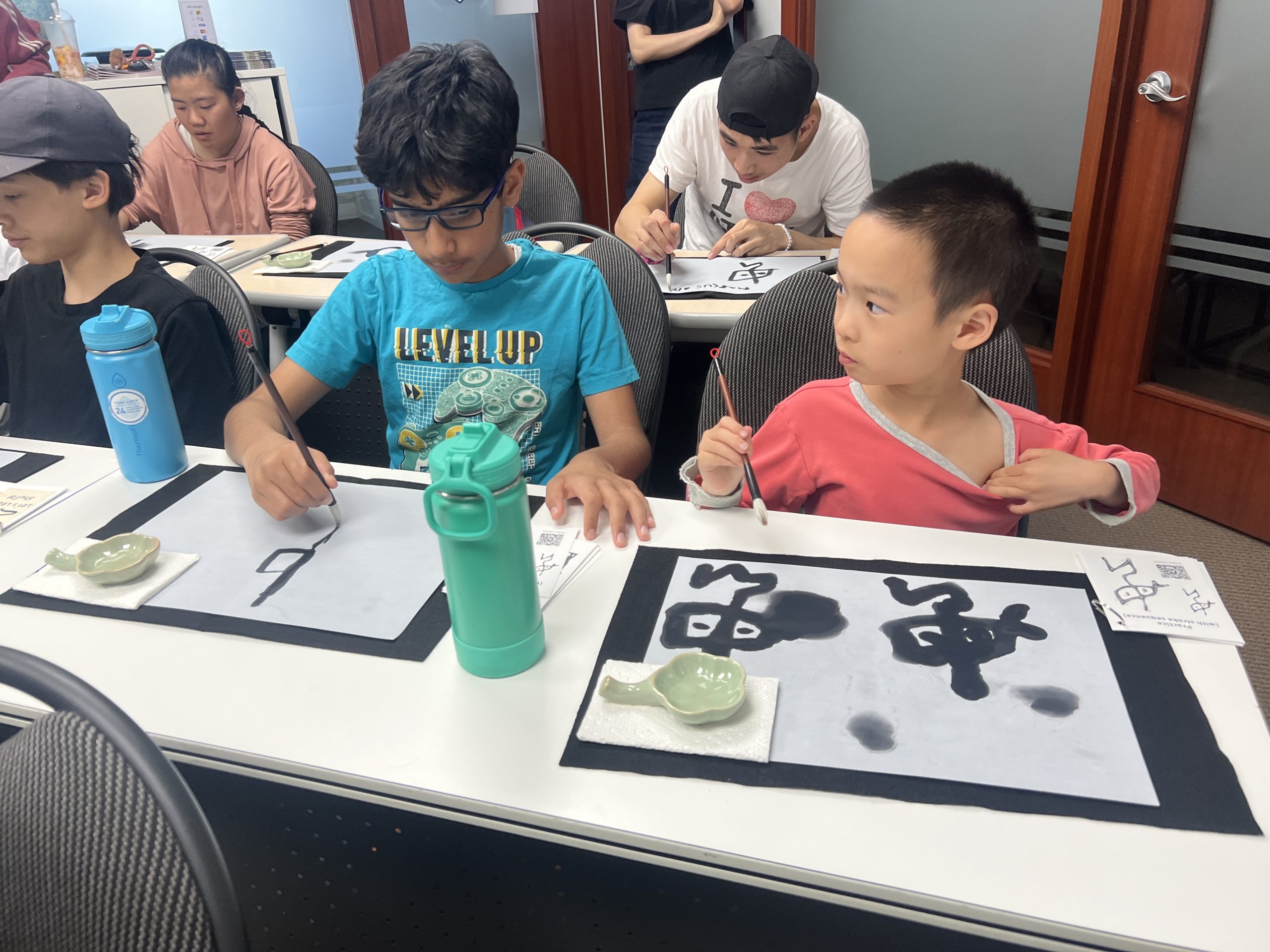 Group of youth participants at the Shufa calligraphy workshop